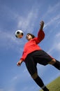 Soccer Football Player in red controlling ball