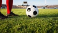 Soccer or football player standing with ball on the field for Ki Royalty Free Stock Photo