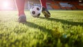 Soccer or football player standing with ball on the field for Ki Royalty Free Stock Photo