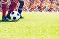 soccer or football player standing with ball on the field for Kick the soccer ball at football stadium,Soft focus Royalty Free Stock Photo