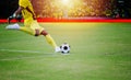 Soccer or football player standing with ball on the field for Kick the soccer ball at football stadium Royalty Free Stock Photo