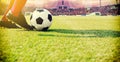 Soccer or football player standing with ball on the field for Ki Royalty Free Stock Photo