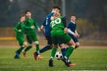 Soccer football players competing for ball and kick ball during match in the stadium on a rainy day Royalty Free Stock Photo