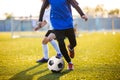 Soccer Football Players Running with Ball. Footballers Kicking Football Ball Royalty Free Stock Photo