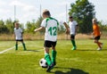 Soccer Football Players Running with Ball. Footballers Kicking Football Ball Royalty Free Stock Photo