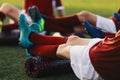 Soccer Football Players in a Team on Fitness Workout to Relieve Muscle Tightness, Soreness, and Inflammation