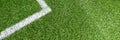 Soccer football sport background. Green synthetic artificial grass soccer sports field with white corner stripe line Royalty Free Stock Photo