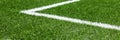 Soccer football sport background. Green synthetic artificial grass soccer sports field with white corner stripe line Royalty Free Stock Photo