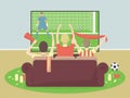 Soccer / football team fans watch TV with game, sitting on the couch. Celebrating goal scored. Royalty Free Stock Photo