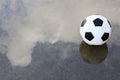 Soccer football on wet ground Royalty Free Stock Photo