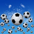 Soccer footballs set in High Cloud Sky