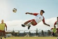 Soccer, game and man kicking a ball during training with the team on a field for sports. Athlete football player in the