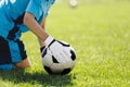 Soccer Goalie With Classic Football Ball. Goalkeeper on Grass Field Holding Ball in Hands Royalty Free Stock Photo