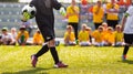 Soccer Goalkeeper Throw. Football Training Game for Kids. Young Boy as a Football Goalkeeper Standing in a Goal Royalty Free Stock Photo