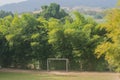 Soccer goals with trees surrounded it.