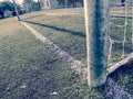 The soccer green field view through white square gate net. Football sport background