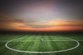 Soccer green grass field at sunset Royalty Free Stock Photo
