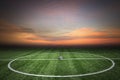 Soccer green grass field at sunset