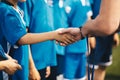 Soccer handshake during ceremony. Kids getting awarded with golden medals after school tournament Royalty Free Stock Photo