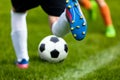 Soccer Kick. Footballer Kicking Ball on Grass Pitch. Football Soccer Player Hits a Ball Royalty Free Stock Photo