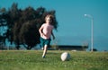 Soccer kid. Kids play football on outdoor stadium field. Little boy kicking ball. School football sports club. Kids Royalty Free Stock Photo