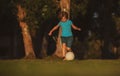 Soccer kid. Kids play football on outdoor stadium field. Little boy kicking ball. School football sports club. Training Royalty Free Stock Photo