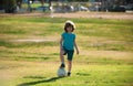 Soccer kids, child boy play football outdoor. Young boy with soccer ball doing kick. Football soccer players in motion Royalty Free Stock Photo