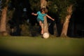 Soccer kids, child boy play football outdoor. Young boy with soccer ball doing kick. Football soccer players in motion Royalty Free Stock Photo