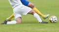 Soccer legs in dribble Royalty Free Stock Photo