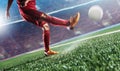 Soccer player in action kick ball at stadium. Royalty Free Stock Photo