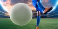 Soccer player in action kick ball at stadium. Royalty Free Stock Photo