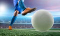 Soccer player in action kick ball at stadium. Royalty Free Stock Photo