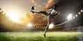 Soccer player in action on sunset stadium panorama background Royalty Free Stock Photo