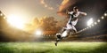 Soccer player in action on sunset stadium panorama background Royalty Free Stock Photo