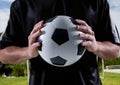 soccer player with ball in his hands, field background Royalty Free Stock Photo