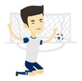 Soccer player celebrating scoring goal. Royalty Free Stock Photo