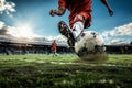 A soccer player dribbling and kicking a ball on a field Royalty Free Stock Photo