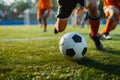 A soccer player dribbling and kicking a ball on a field Royalty Free Stock Photo