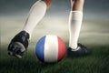 Soccer player exercises with ball at field Royalty Free Stock Photo