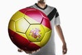 A soccer player holding Spain soccer ball