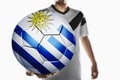 A soccer player holding Uruguay soccer ball Royalty Free Stock Photo