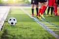 Soccer player Jogging and jump between marker for football training. Ladder Drills Exercises for Football Soccer team Royalty Free Stock Photo