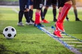 Soccer player Jogging and jump between marker for football training. Ladder Drills Exercises for Football Soccer team Royalty Free Stock Photo