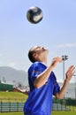 Soccer player juggling ball Royalty Free Stock Photo