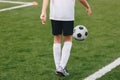 Soccer Player Juggling a Soccer Ball. Young Boy Playing Football Royalty Free Stock Photo