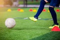 Soccer player jump and stomp for trap and control football with Royalty Free Stock Photo