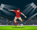 Soccer Player Kicking Ball in stadium. Light, stands, fans.