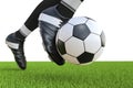 Soccer player kicking soccer ball in motion Royalty Free Stock Photo