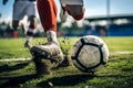 A soccer player dribbling and kicking a ball on a field Royalty Free Stock Photo