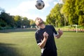 Soccer player playing with ball on field Royalty Free Stock Photo